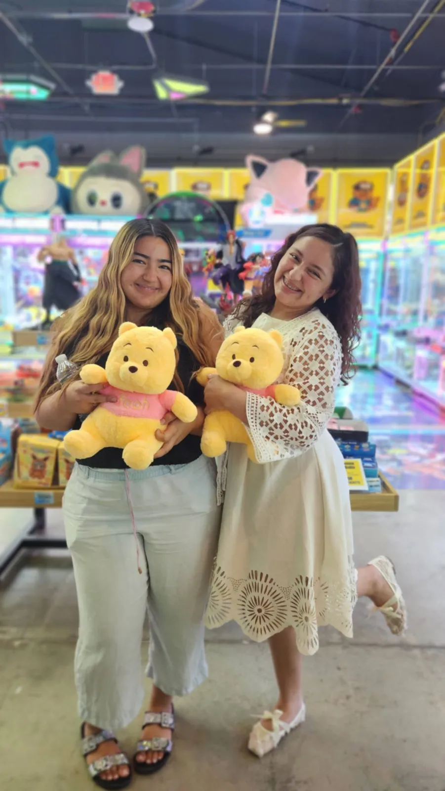 Friends with matching Winnie the Pooh plushes