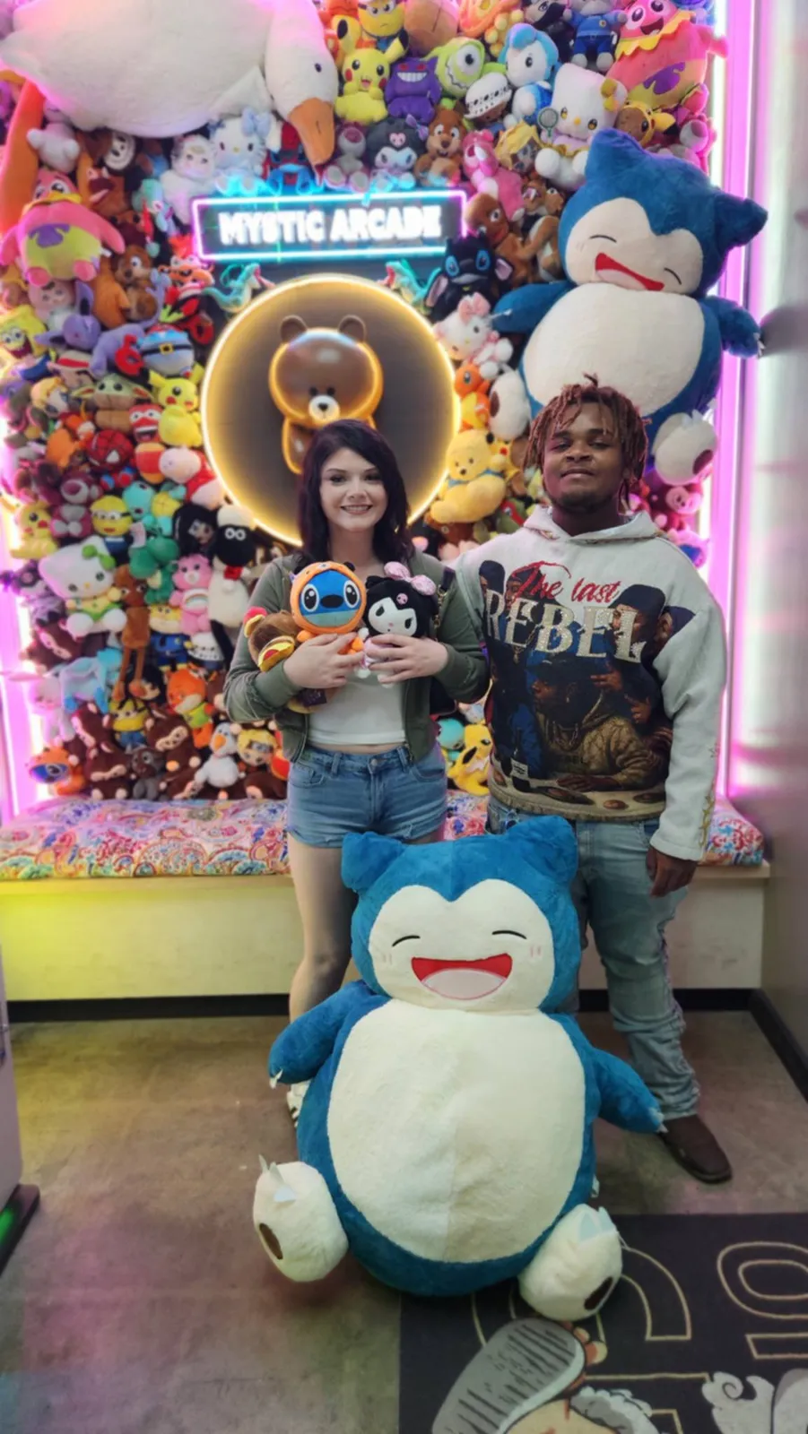 Guests with a giant Snorlax plush