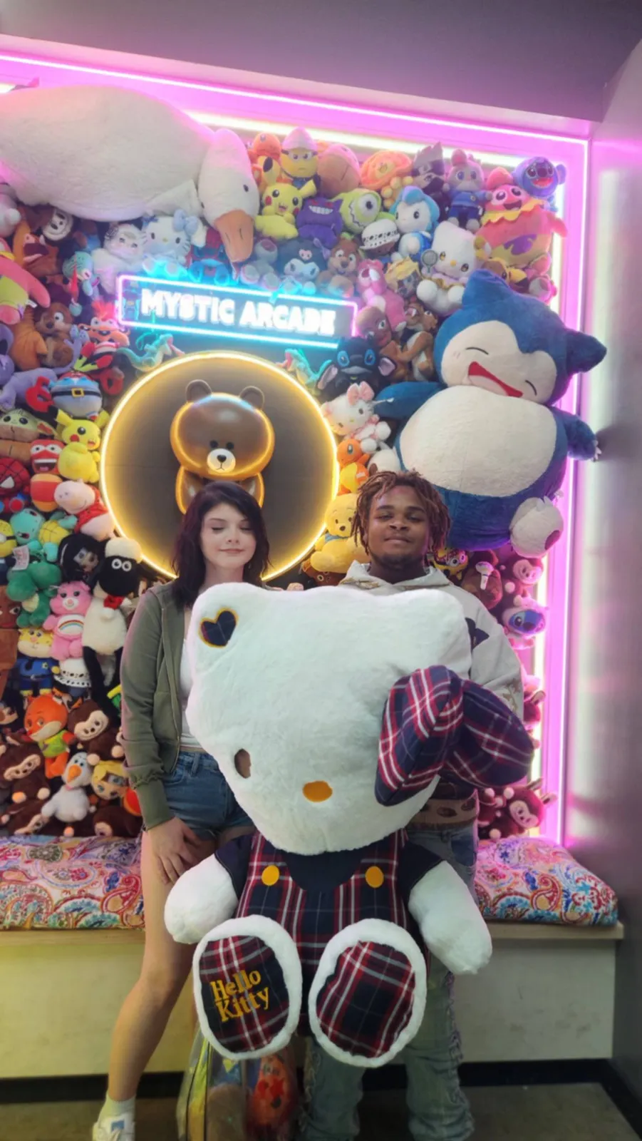 Guests with a giant Hello Kitty plush